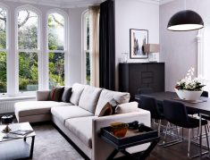 Room with arched windows and sectional sofa
