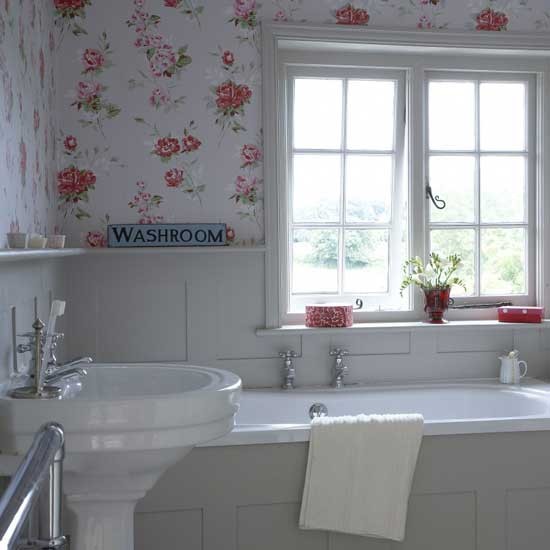 Spacious All White Bathroom with Red Accesories