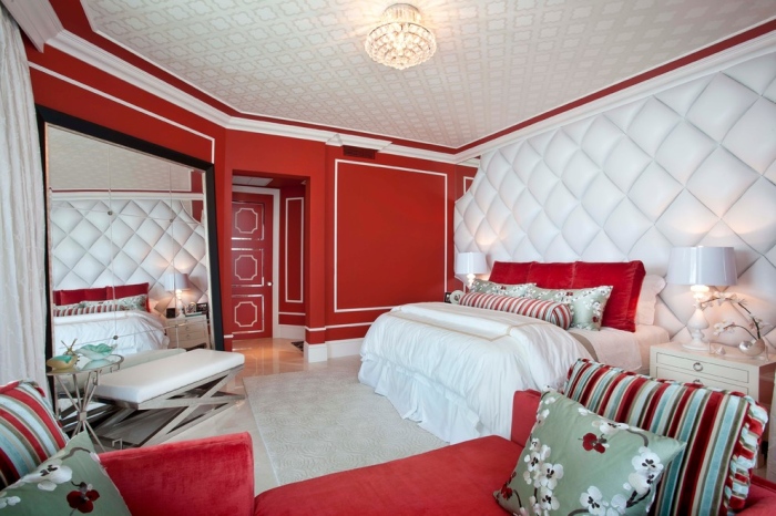 red has been used in this room which fits in perfectly with the other white elements