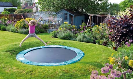 Garden and children play area with a sunken trampoline