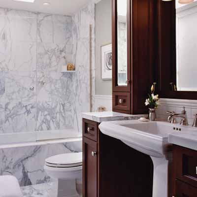 This bathroom is made up of white marble tiles to make the space roomier