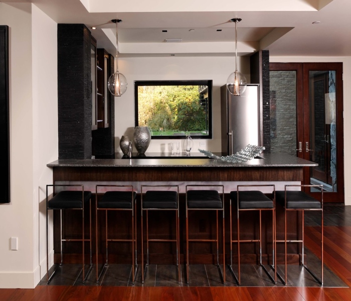 Contemporary home bar with black cabinets