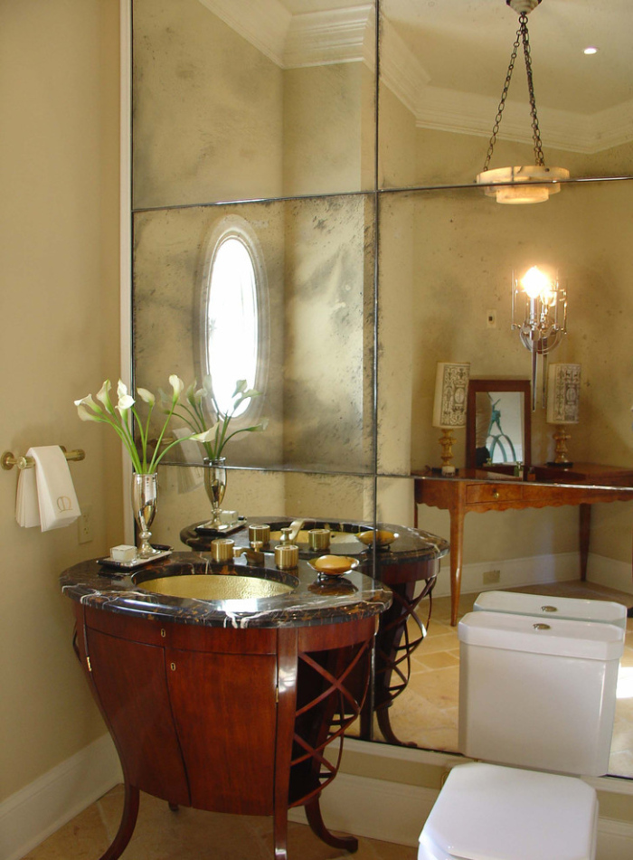 Powder room with antique mirror tile design