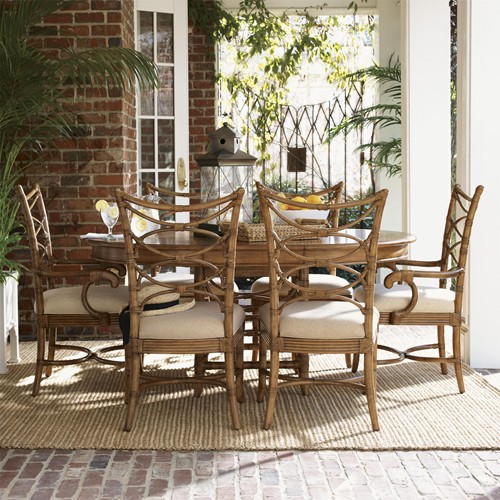 The table contrasts beautifully with rattan chairs