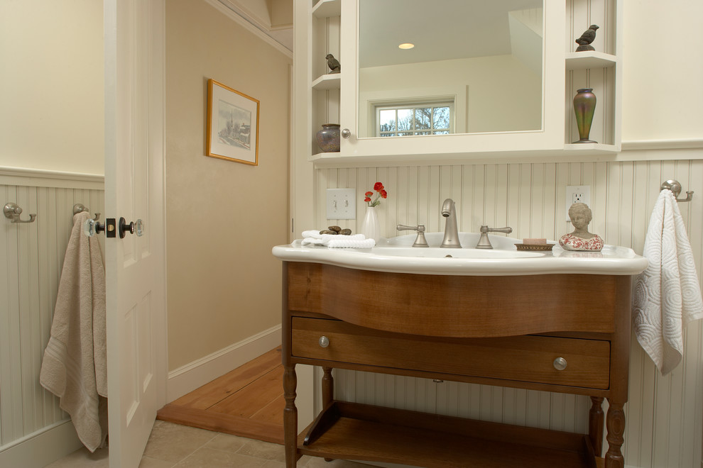 The vanity sink was highlighted by the white beadboard